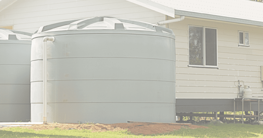 large sealed water storage container in front of a house